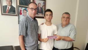 BAŞKAN YAYLA'DAN LGS ŞAMPİYONUNA ANLAMLI HEDİYE