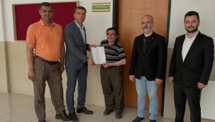 MHP Karatay İlçe Başkanı Muammer Özcan Mazbatasını Teslim Aldı 